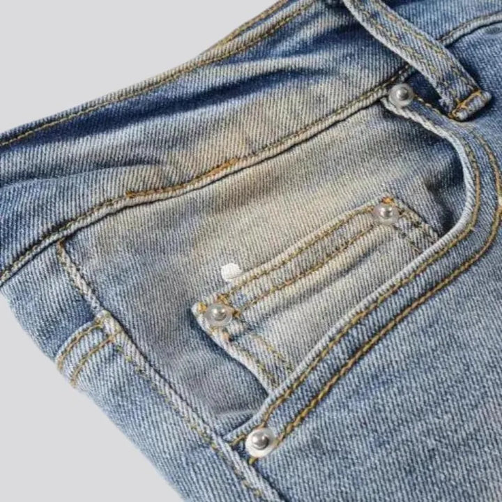 Whiskered crystal-patch jeans